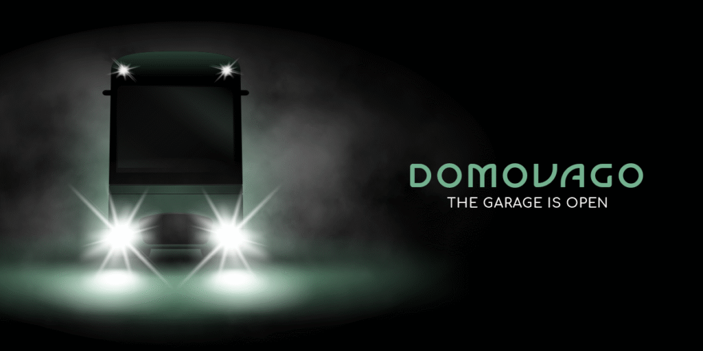 A front view of the Domovago vehicle in a dark mist with headlights on, symbolizing the Domovago project idea and the garage opening.