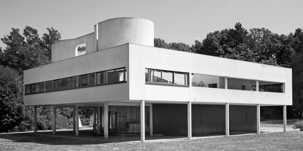 The Villa Savoye, a famous modernist building by Le Corbusier, showing its lifted structure on columns and long horizontal ribbon windows