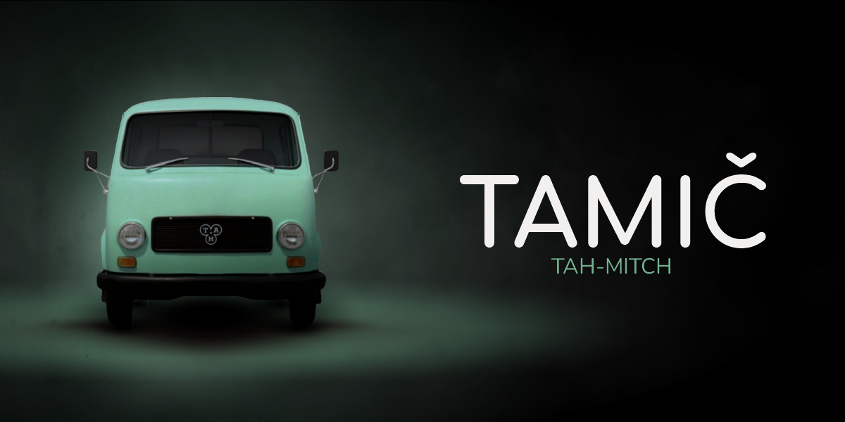 A mint-green, front-facing Tamič truck from the Yugoslavian era, with the phonetic spelling "TAH-MITCH" next to it.