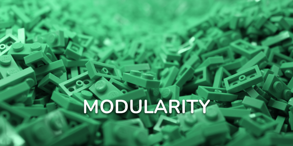 Close-up of green LEGO bricks with the word “Modularity” written across the center, symbolizing creativity and modular design.