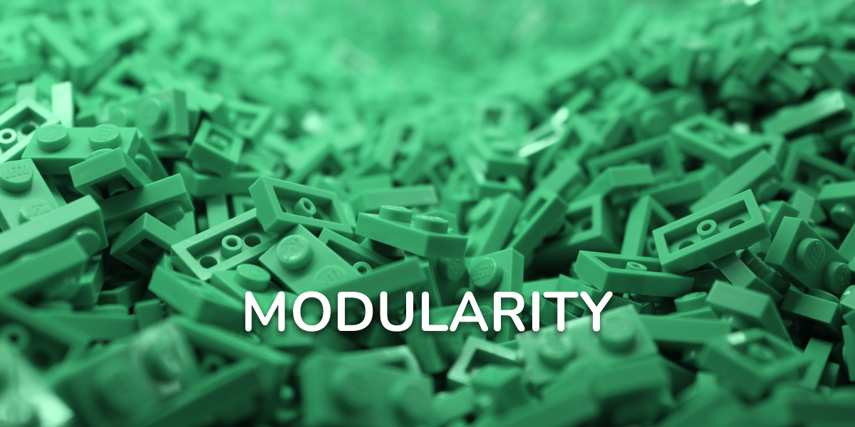 Close-up of green LEGO bricks with the word “Modularity” written across the center, symbolizing creativity and modular design.